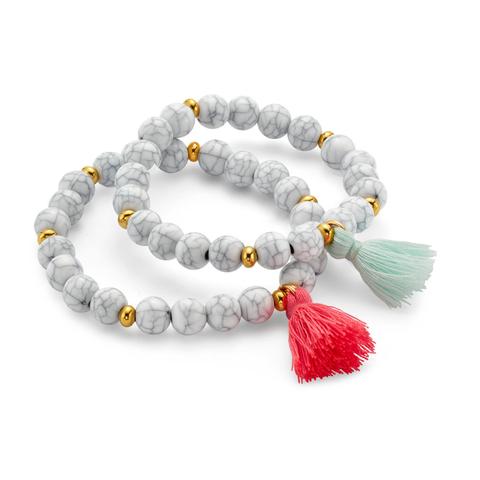 White whispers stackable bracelet with Tassel pendants 